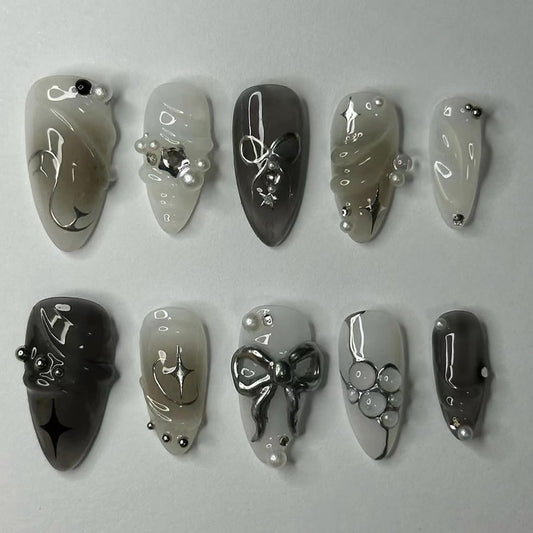 24PCS Black Press on Nails Medium Almond Fake Nails with 3D Alloy Bow Pearl Design Silver Shining Star Full Cover False Nails Water Drops French Tips Cute Stick on Nails Acrylic Fingernails for Women