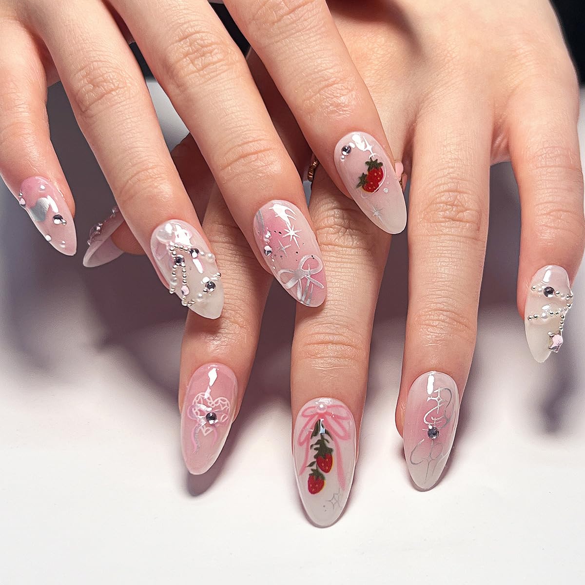 Long Almond Press on Nails French Tip Pink Fake Nails Bow Rhinestones with Strawberry Pattern Design Pearl False Nails Heart Stick on Nail Full Cover Reusable Acrylic Nail Art for Women 24 Pcs
